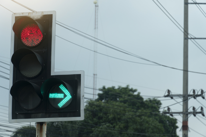 Transportation background of Traffic lights red, do not go ahead And green traffic signs, turn right.