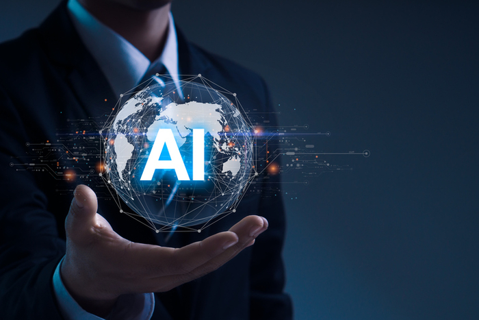 AI (Artificial intelligence) growing concept. Businessman hand holding global network with AI word, futuristic technology.