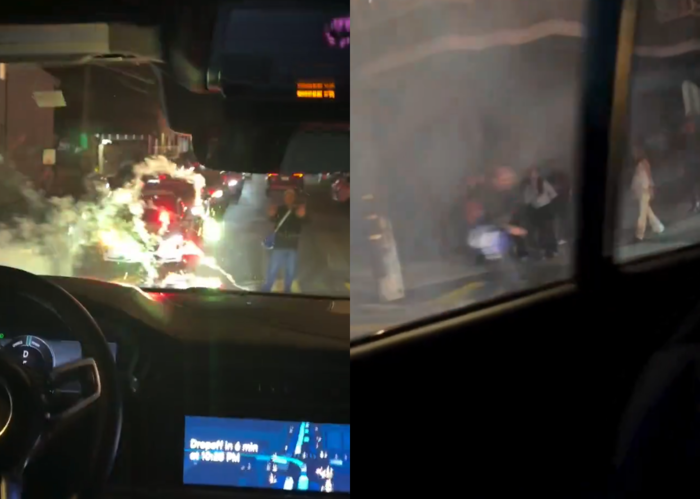 자율주행택시 웨이모가 폭죽 위로 지나가는 모습. 차량 주변에 연기가 자욱하다. 사진=엑스 캡처