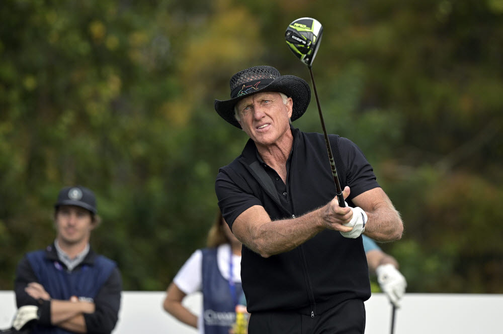 FILE - Greg Norman, of Australia, watches his tee shot on the first hole during the final round of the PNC Championship golf tournament on Dec. 20, 2020, in Orlando, Fla. Norman is heading up a Saudi-backed company that plans 10 new tournaments on the Asian Tour to attract top players. It could be the first step toward Norman trying again to start a world tour. (AP Photo/Phelan M. Ebenhack, File) FILE PHOTO