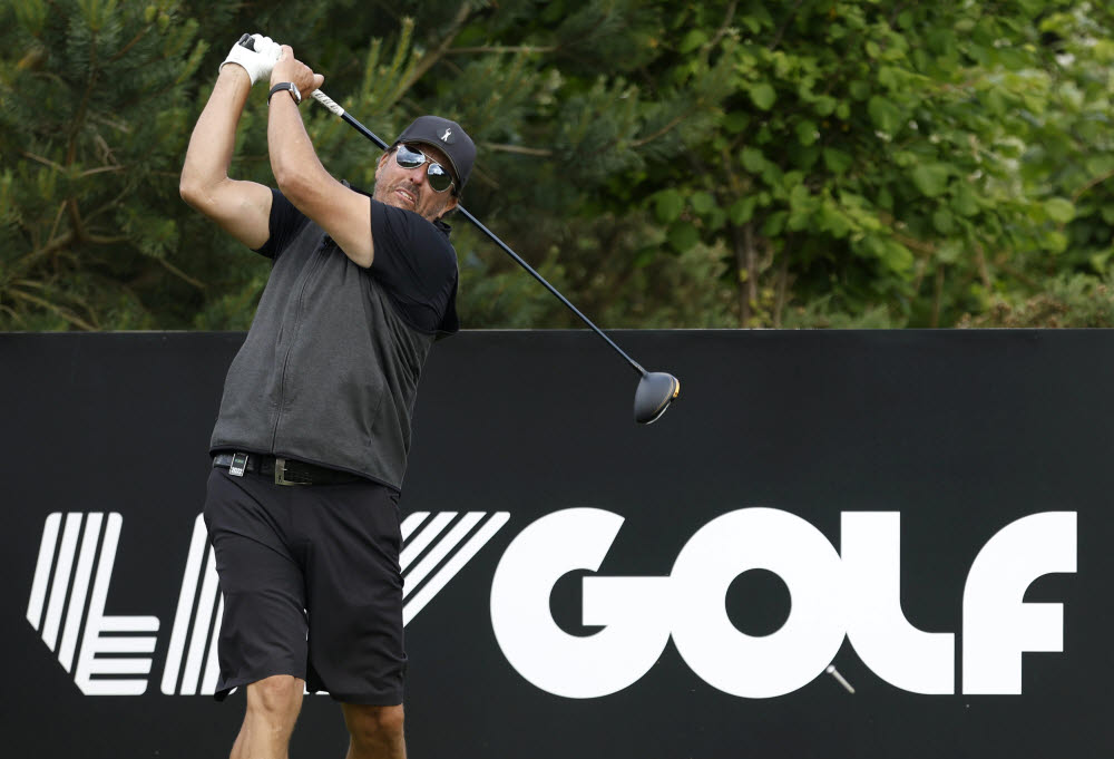 Phil Mickelson plays on the 18th, during the Pro-Am at the Centurion Club, in Hertfordshire, England, ahead of the LIV Golf Invitational Series, Wednesday June 8, 2022. (Steven Paston/PA via AP) UNITED KINGDOM OUT; NO SALES; NO ARCHIVE; PHOTOGRAPH MAY NOT BE STORED OR USED FOR MORE THAN 14 DAYS AFTER THE DAY OF TRANSMISSION; MANDATORY CREDIT