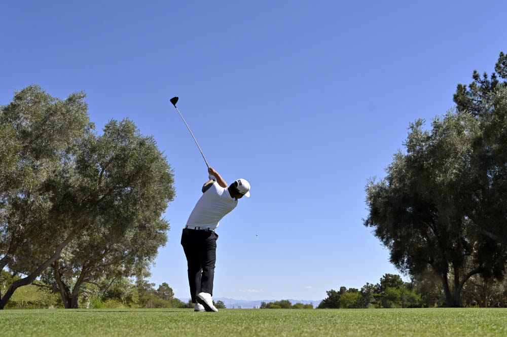 Tom Kim, of South Korea, makes his tee shot on the fourth hole during the final round of the Shriners Childrens Open golf tournament, Sunday, Oct. 9, 2022, in Las Vegas. (AP Photo/David Becker)